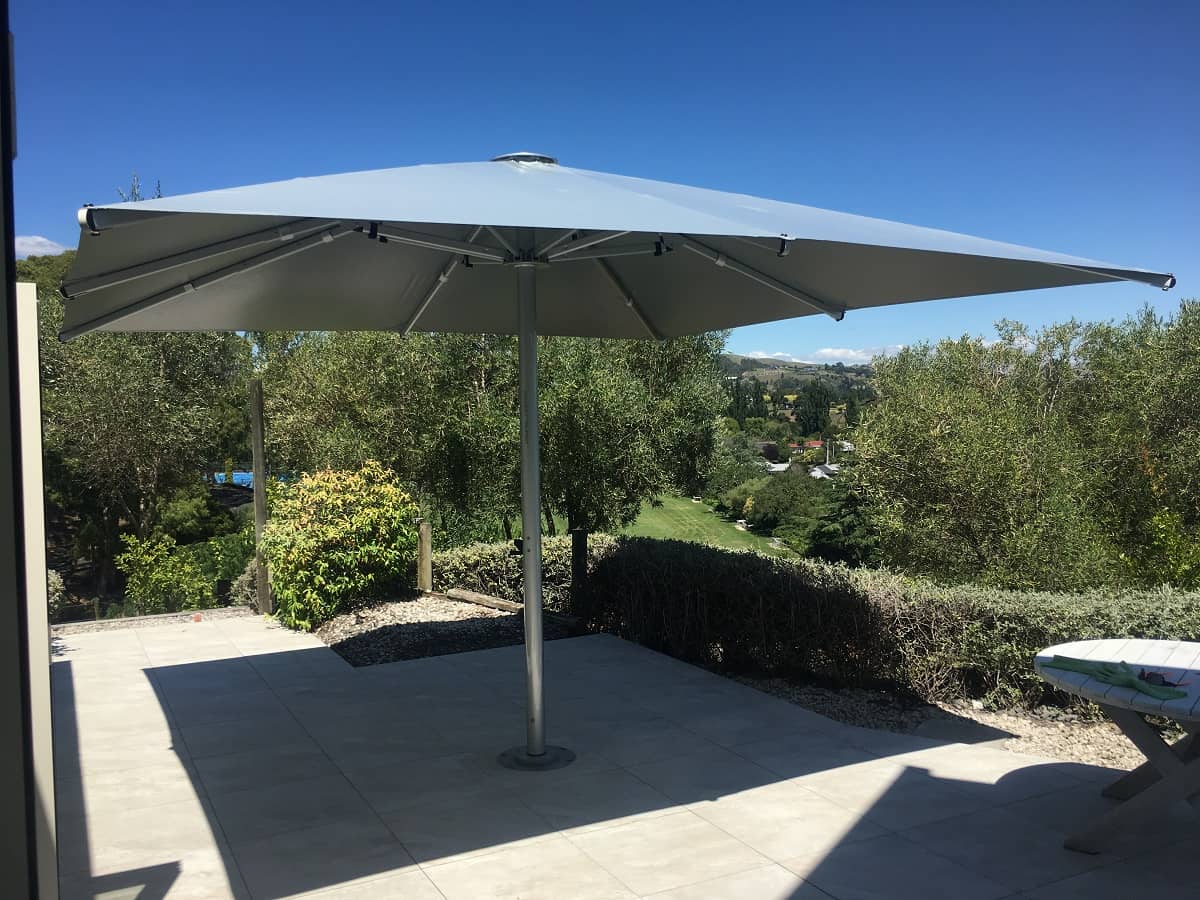 A Shade7 Tempest Market Umbrella installed on a hillside patio in Havelock North, Hawkes Bay NZ