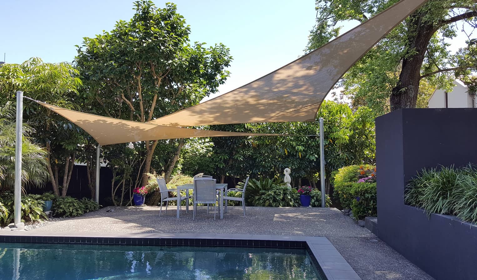 Shade sail provides privacy from a neighbouring 2-storey home