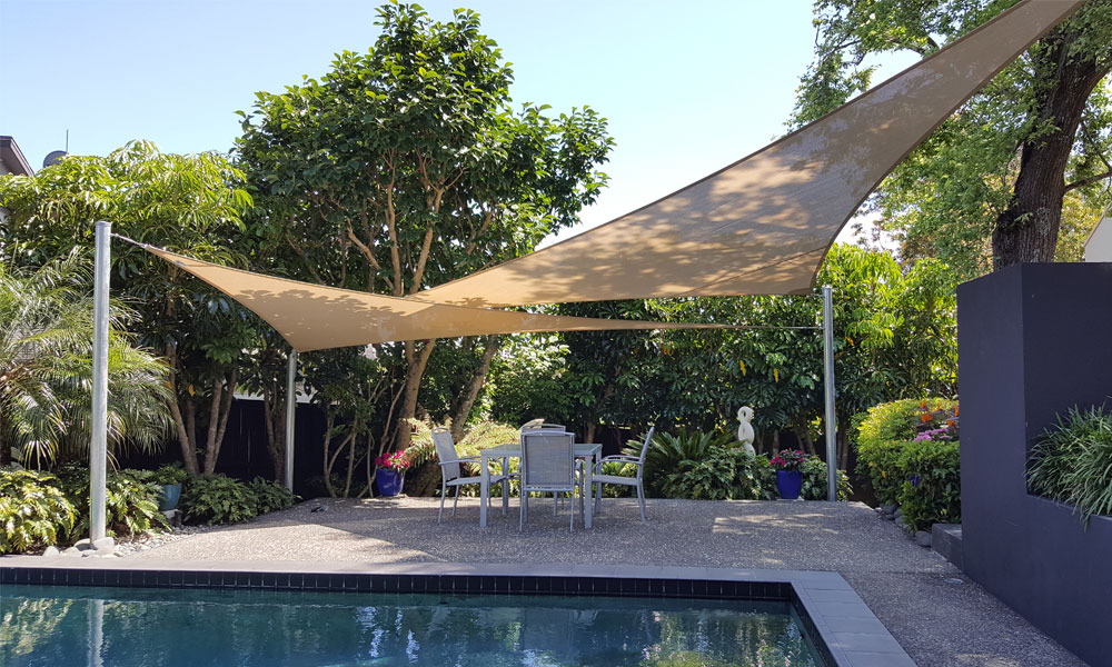 Shade sails by Sunshade NZ providing privacy and sun protection by pool