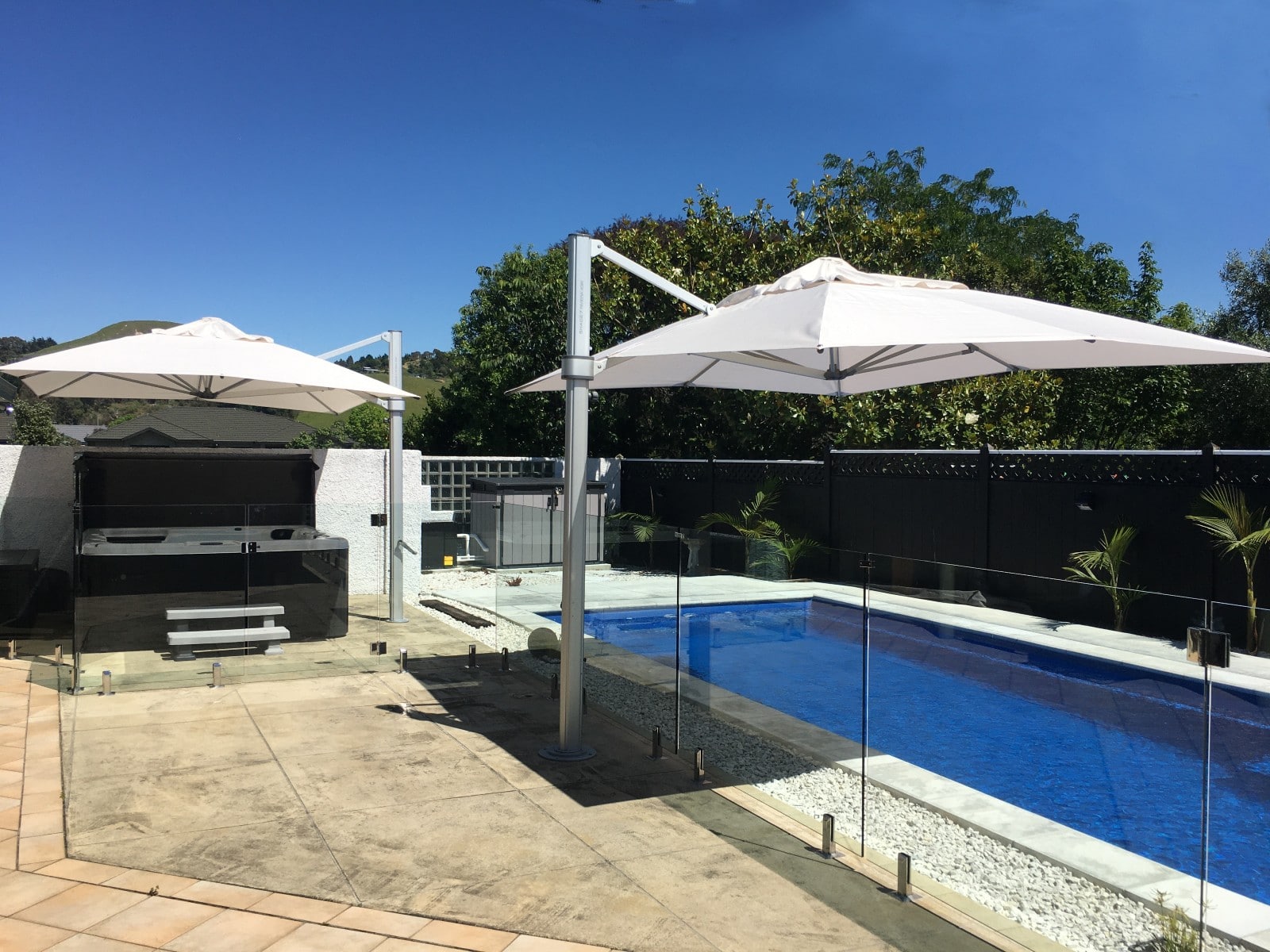 Second outdoor umbrella for poolside haven in Hawkes Bay